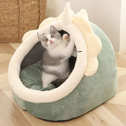 Adorable casa para mascotas con diseño de dinosaurio y juguete